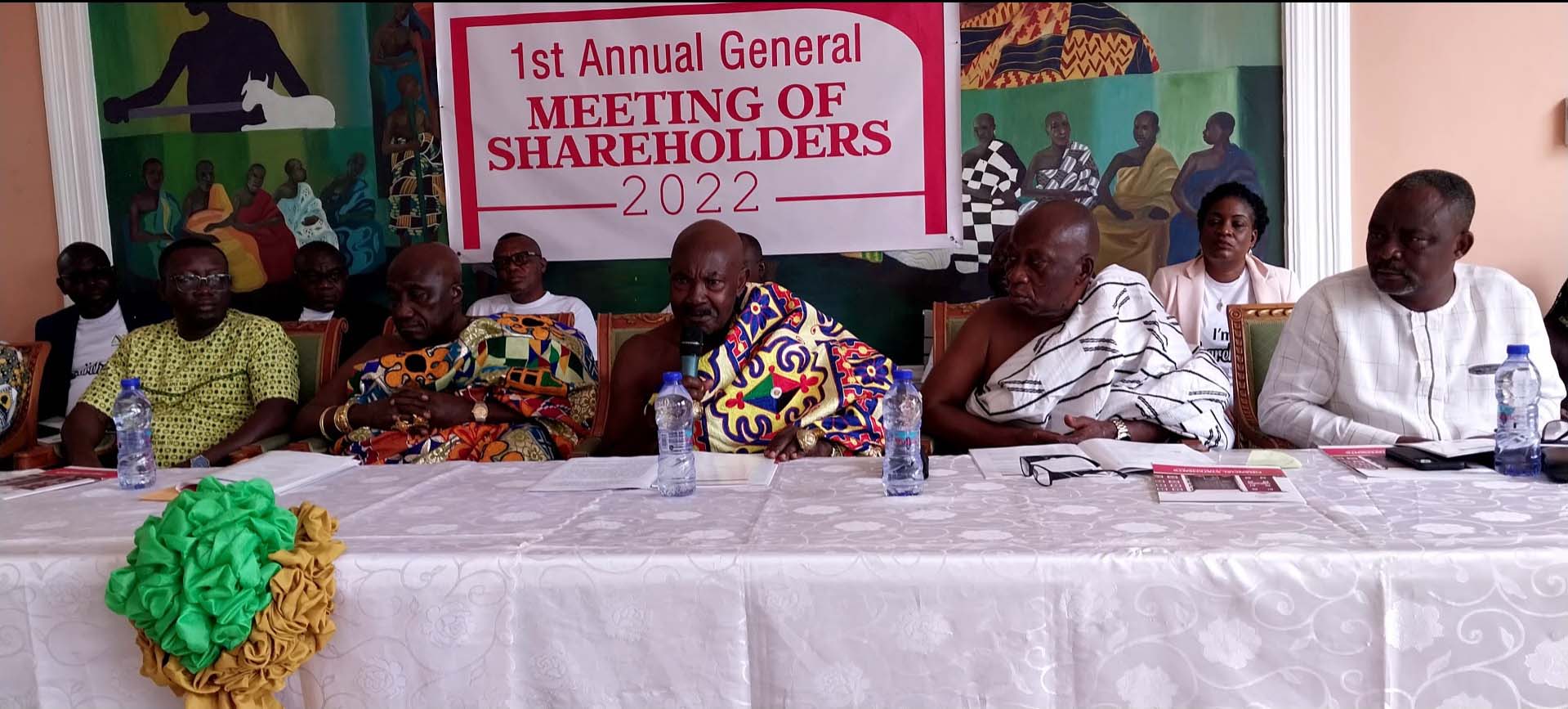 Nana Boakye Ansah Debrah, Chairman of the Board of Directors (middle), flanked by other directors while addressing shareholders